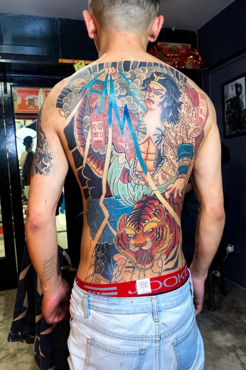 Full Japanese irezumi back piece with a warrior and tiger